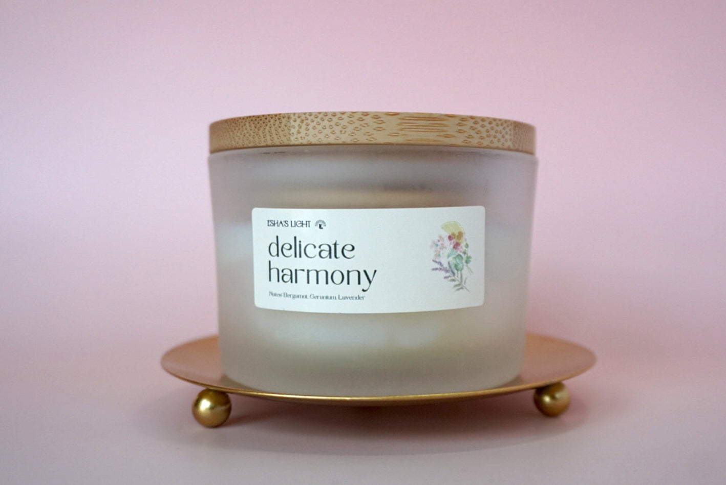 hand-poured floral soy candle in a frosted glass jar